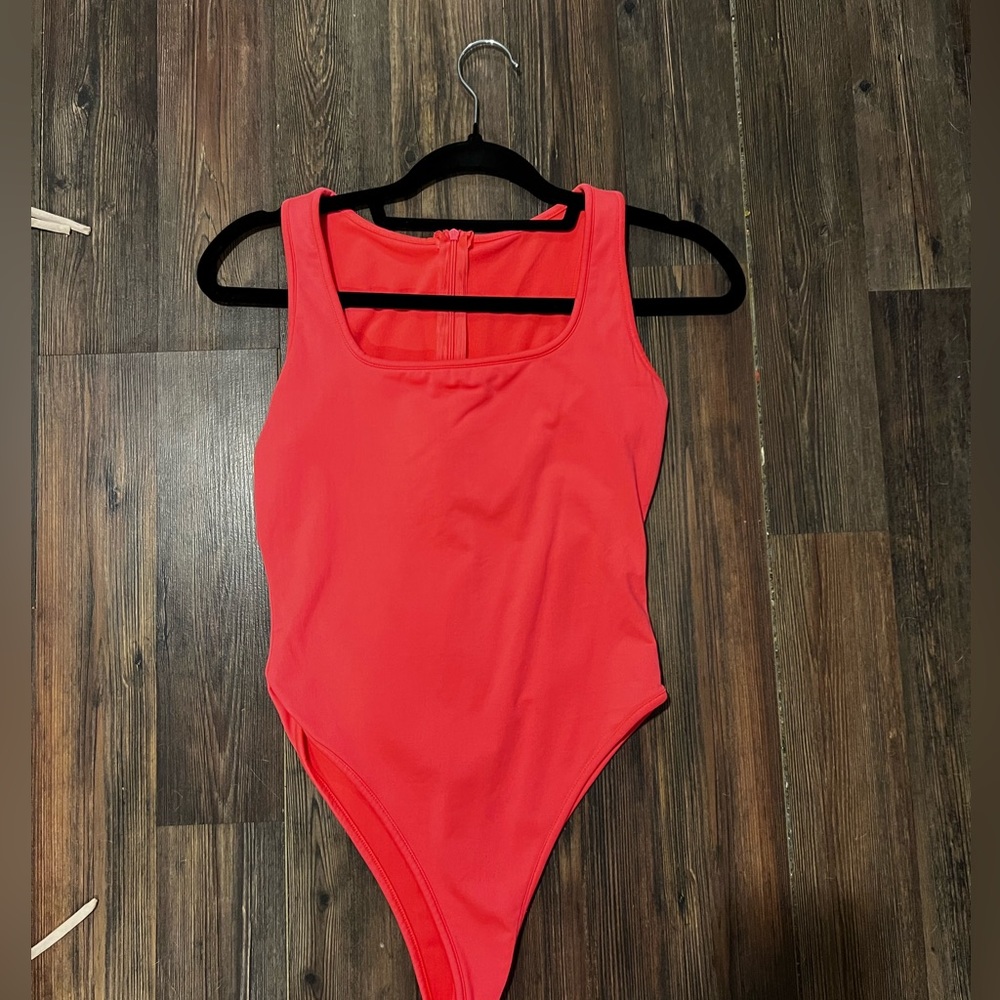 neon pink bodysuit. very comfortable and lightweight.